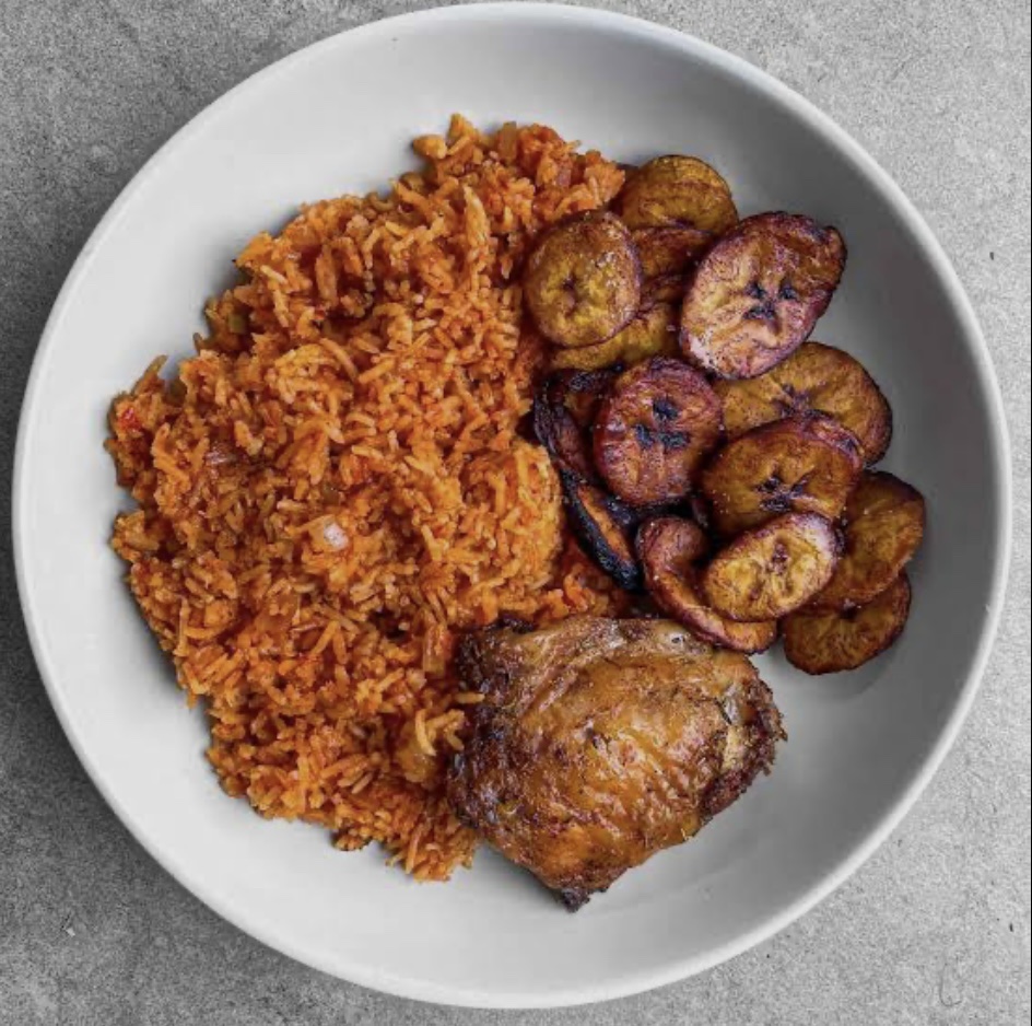Jollof Rice Served With Plantain And Chicken