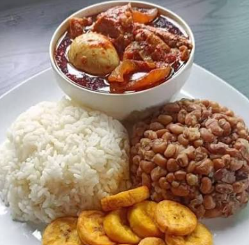 Rice & beans with vegetable sauce and plantain, kpanla, ponmo, boiled egg and any protein