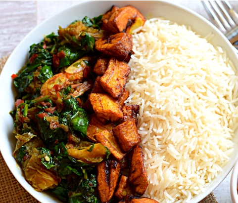 White rice with vegetable sauce and plantain, kpanla, ponmo, boiled egg and any protein