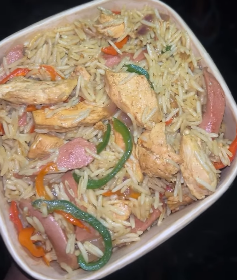 Ts special rice with Turkey (shredded beef, sausage, veggies), plantain, boiled egg & 1 soft drink