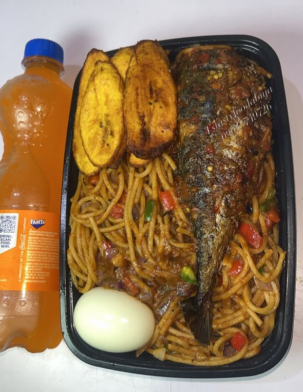 Jollof spaghetti with Protein, boiled egg, plantain & 1 soft drink